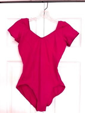 Capezio Women’s Short Sleeve Leotard in Raspberry color.